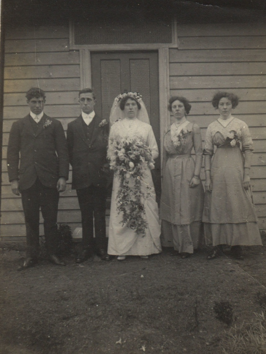 The bride and groom, with best man and bridesmaids